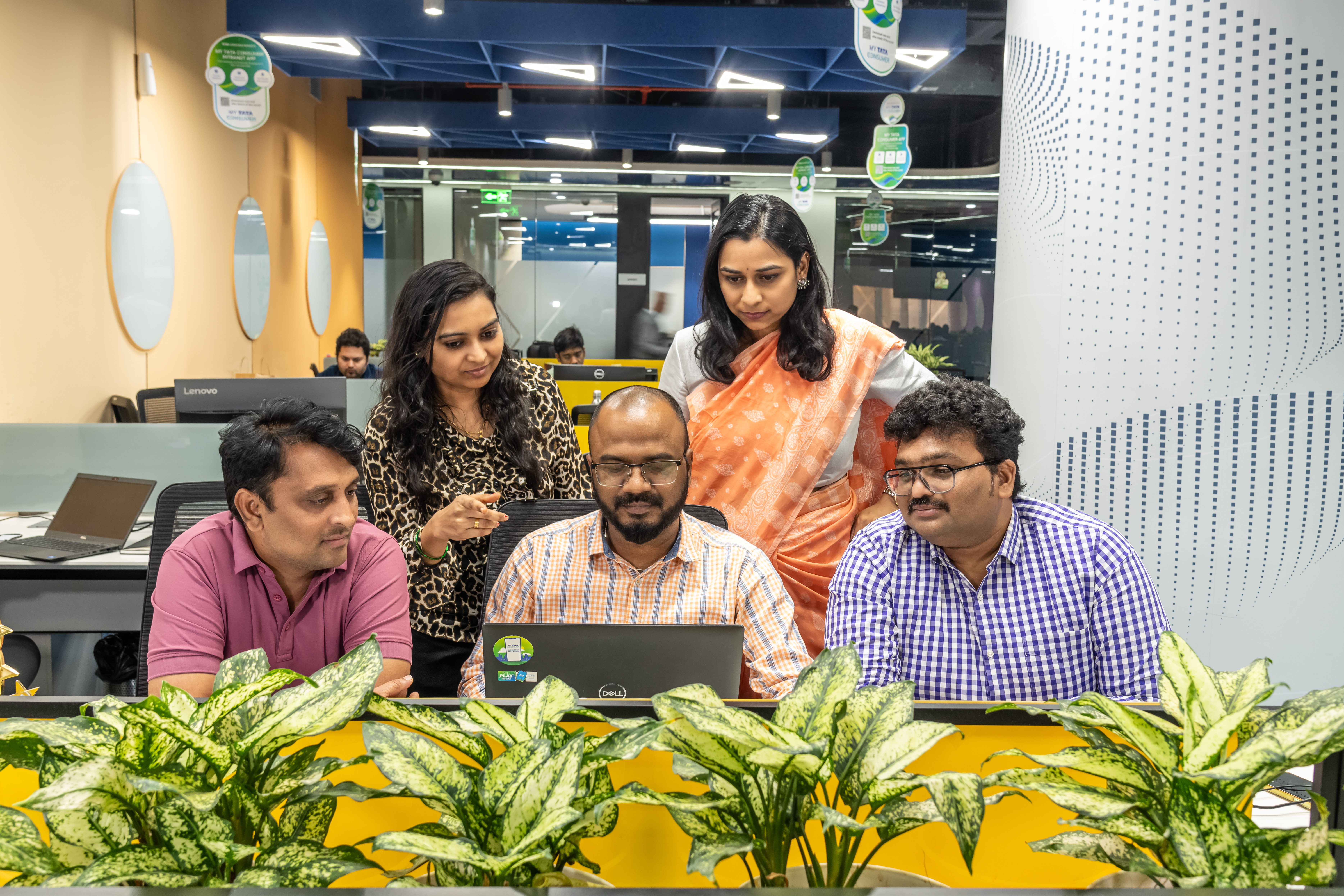 Employees collaborating at desk
