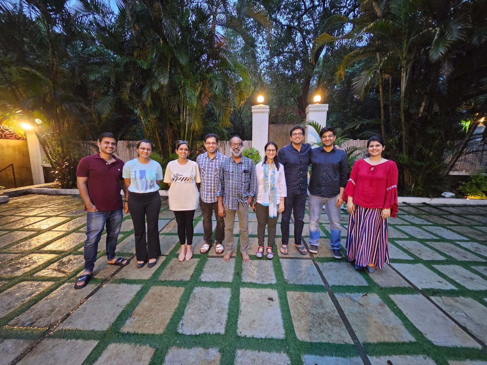 Employees posing for a group photo outdoors